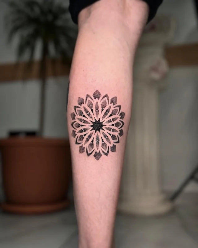 geometric dotwork mandala tattoo on leg calf