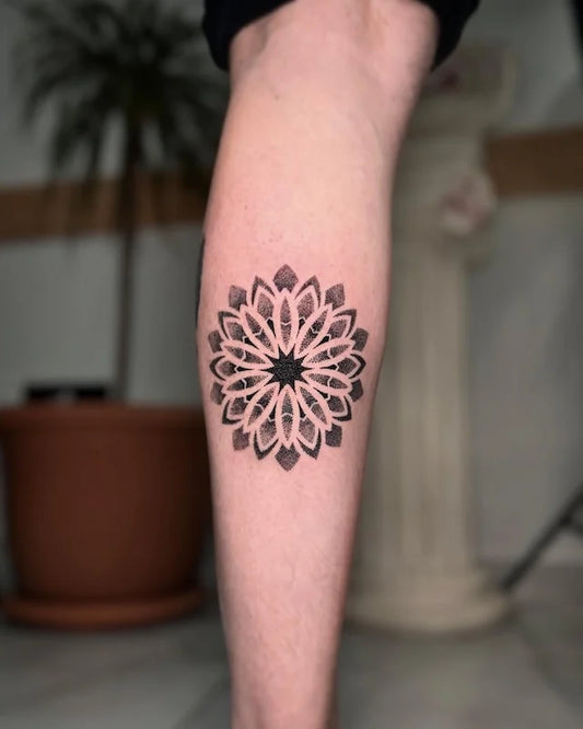 geometric dotwork mandala tattoo on leg calf
