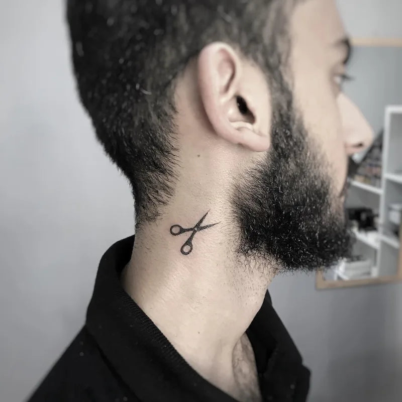 blackwork scissor minimalist tattoo on man neck