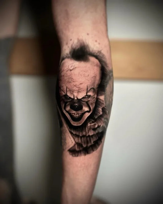 IT clown black and grey realism tattoo on leg