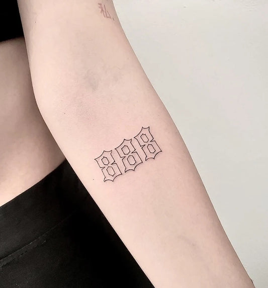 888 numeral outline old lettering font tattoo on woman inner arm