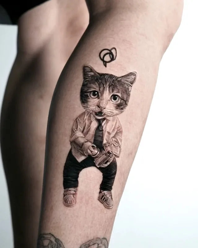 black and grey realism cat head human tattoo on leg