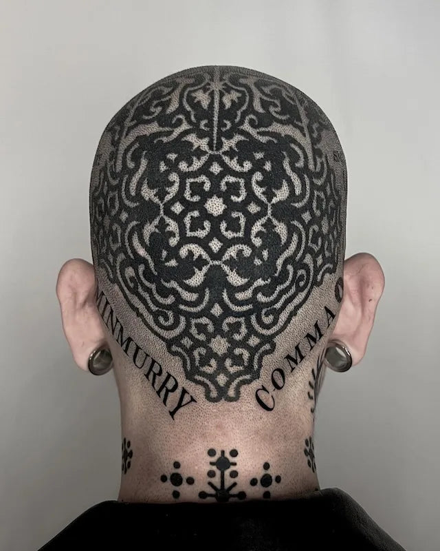 blackwork patterns tattoo on man head