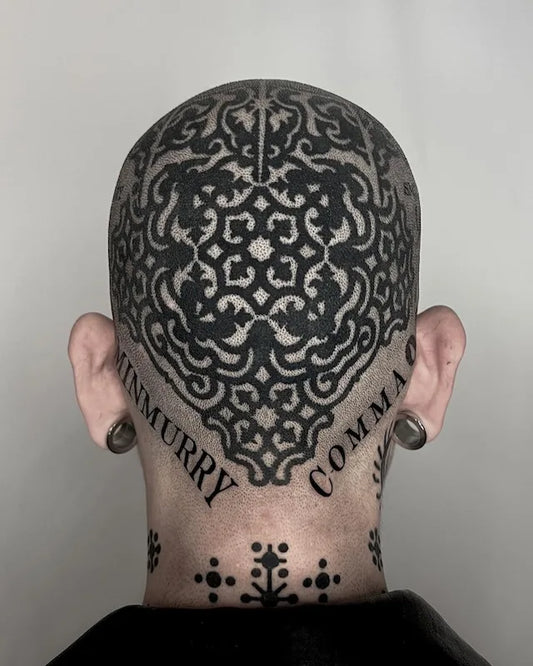 blackwork patterns tattoo on man head