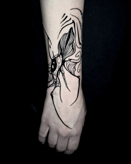 abstract blackwork black lines wrist tattoo