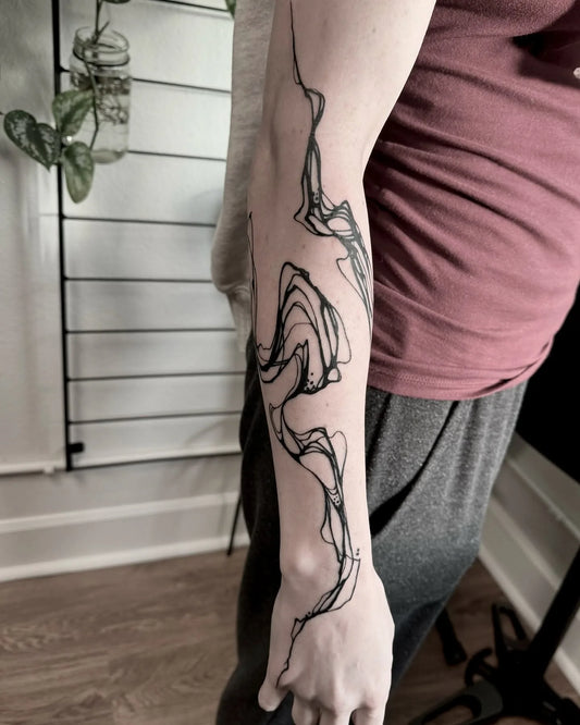 abstract black lines forearm tattoo