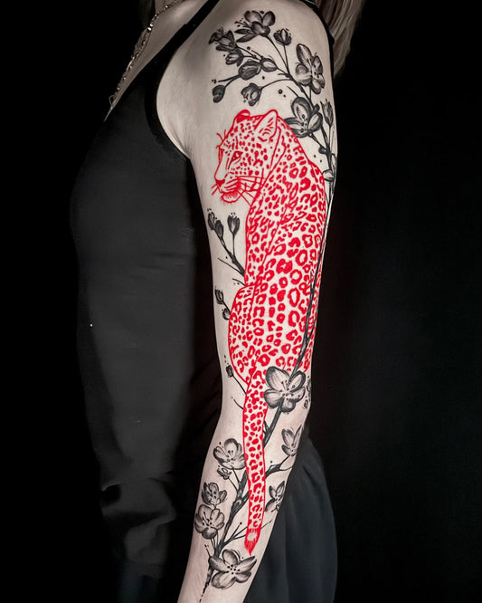 red leopard with black and grey flowers full arm sleeve tattoo