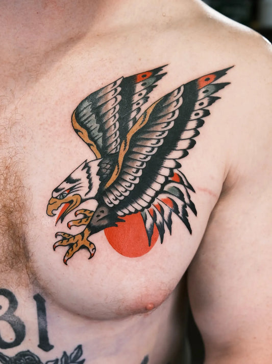 traditional eagle tattoo on man chest