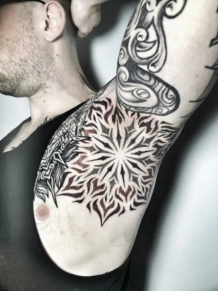 geometric tattoo on man armpit