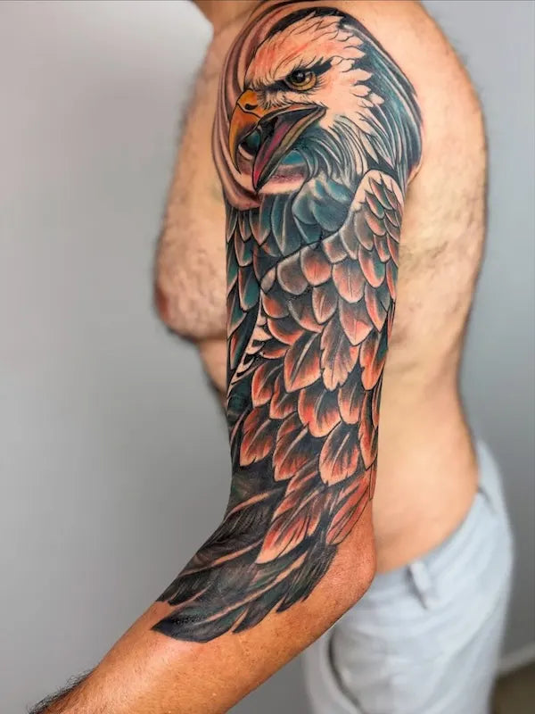 color eagle half arm sleeve tattoo on man upper arm