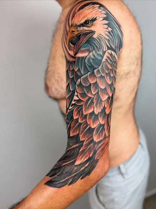 color eagle half arm sleeve tattoo on man upper arm