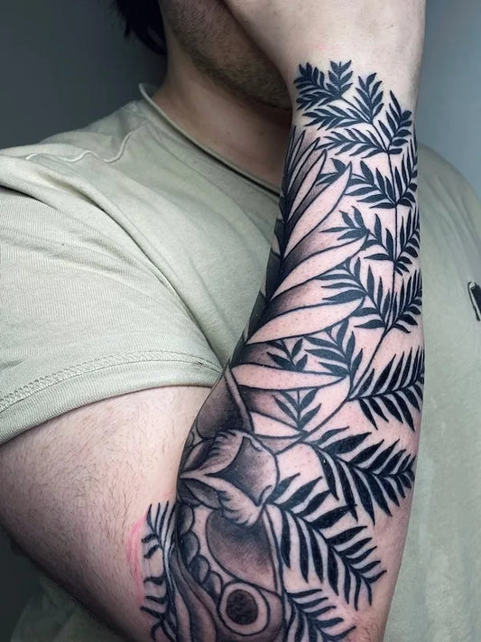 The Last of Us Ellie leaves tattoo on forearm sleeve