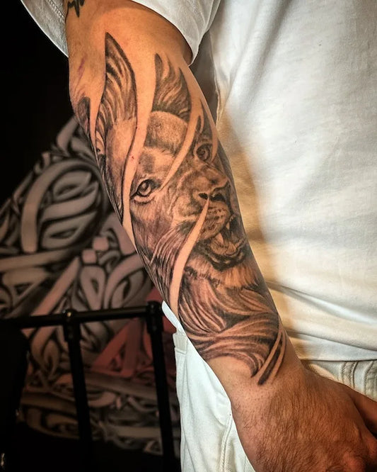 black and grey lion tattoo half arm sleeve