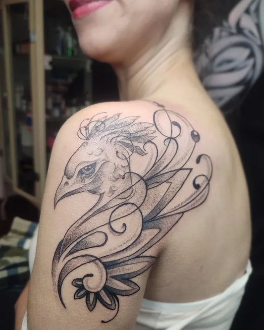 black and grey elegant rooster head tattoo on woman shoulder