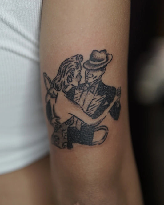 gentleman and woman dancing black and grey tattoo