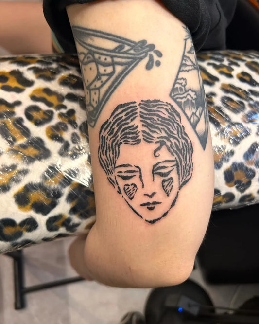 print pattern woman face outline tattoo