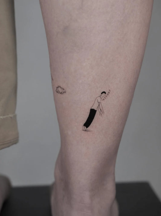 abstract illustrative minimalist little man tattoo on ankle