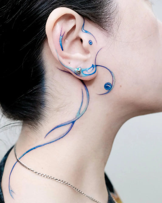 blue watercolor abstract behind the ear tattoo
