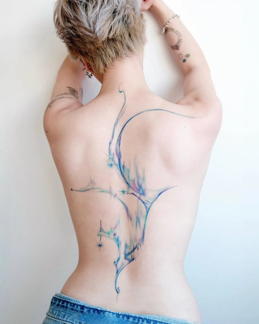 abstract blue watercolor full back woman tattoo