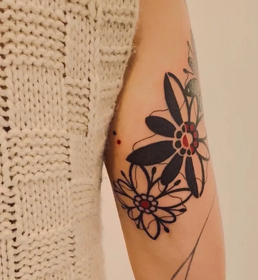 blackwork flower tattoo