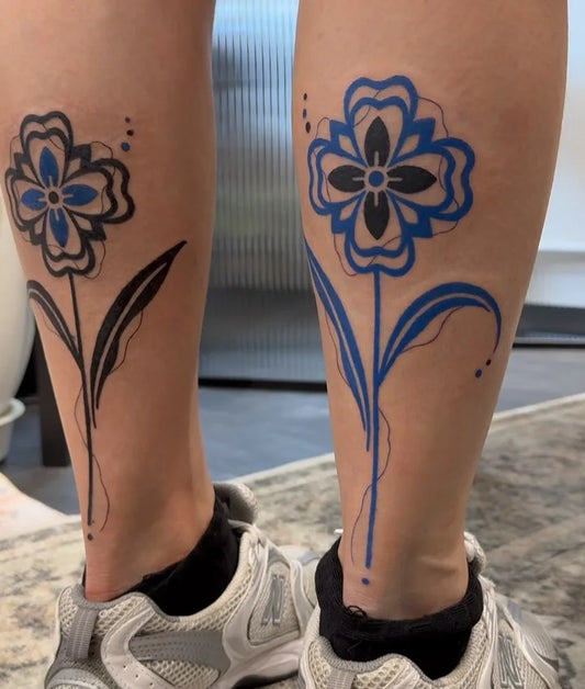 blue blackwork fine line flower calf tattoo