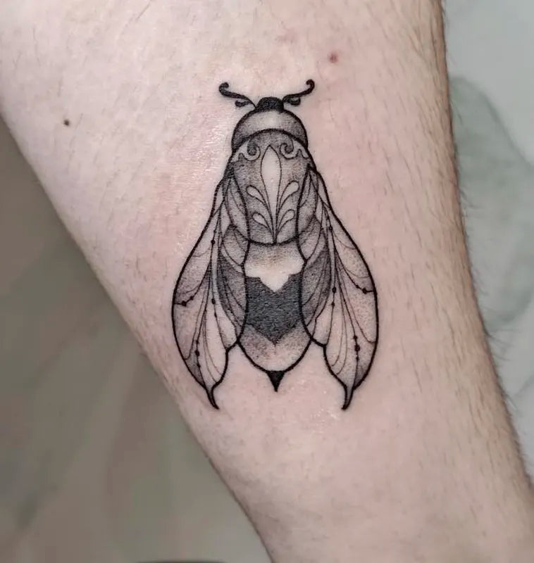 black and grey tattoo of a detailed bee fly