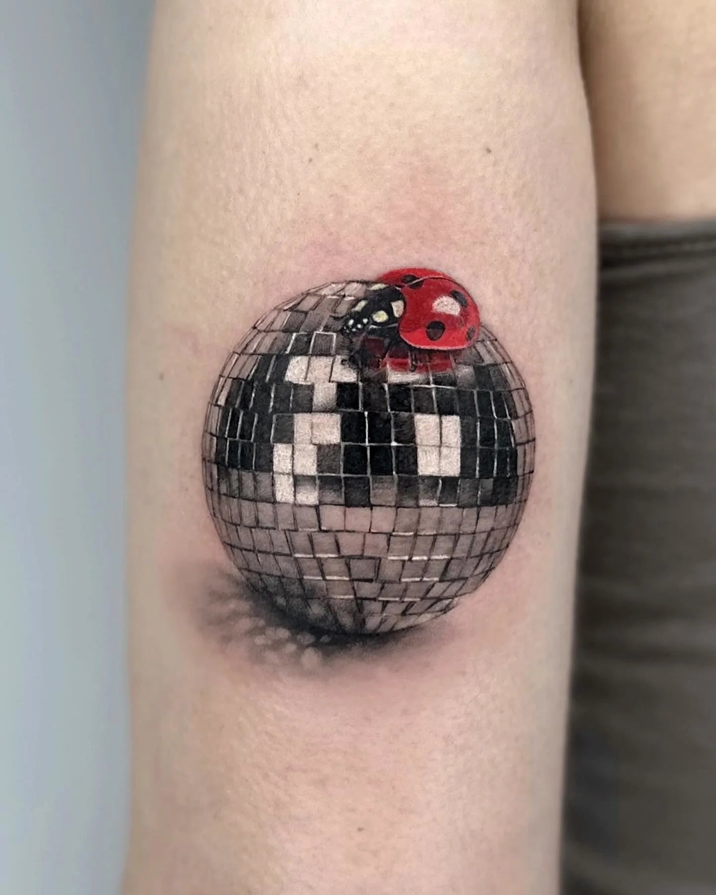 realistic mirror ball ladybug tattoo