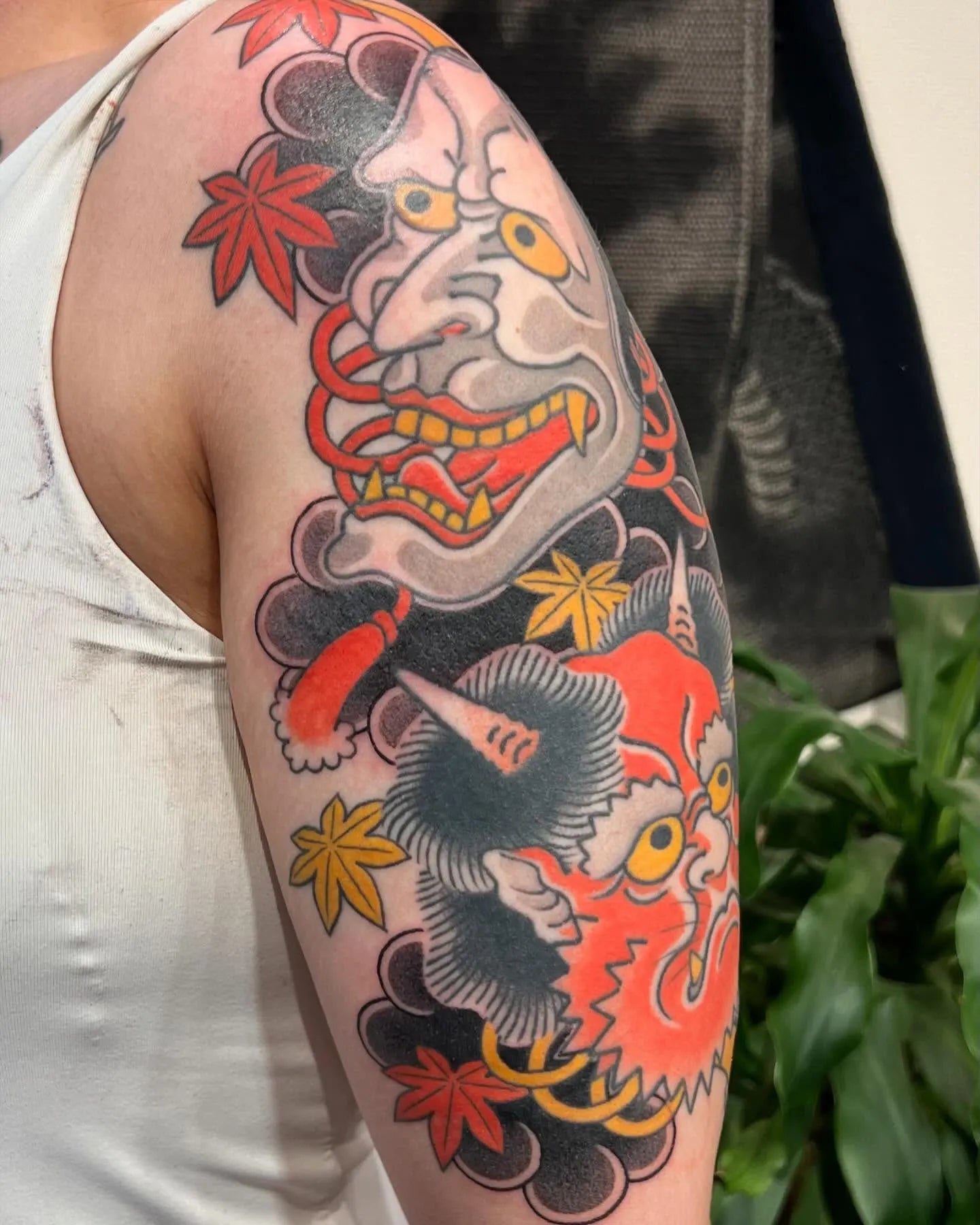 japanese hannya masks half sleeve tattoo on upper arm