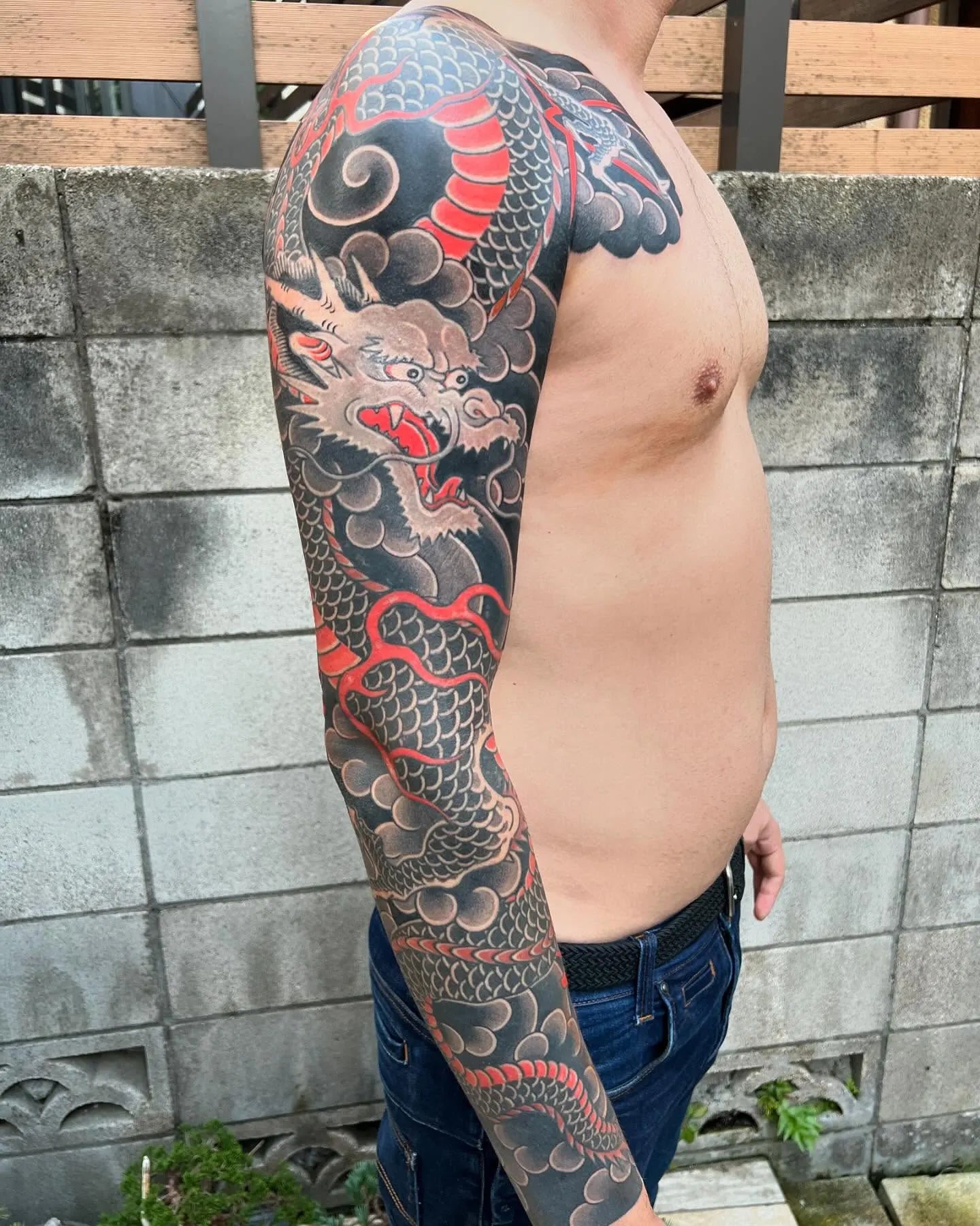 japanese dragon tattoo on man full arm sleeve
