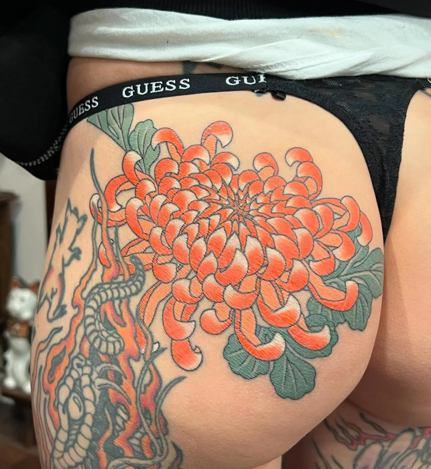 japanese orange lotus flower tattoo on woman hip