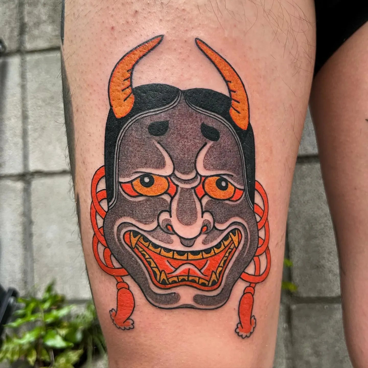 japanese hannya mask tattoo on thigh