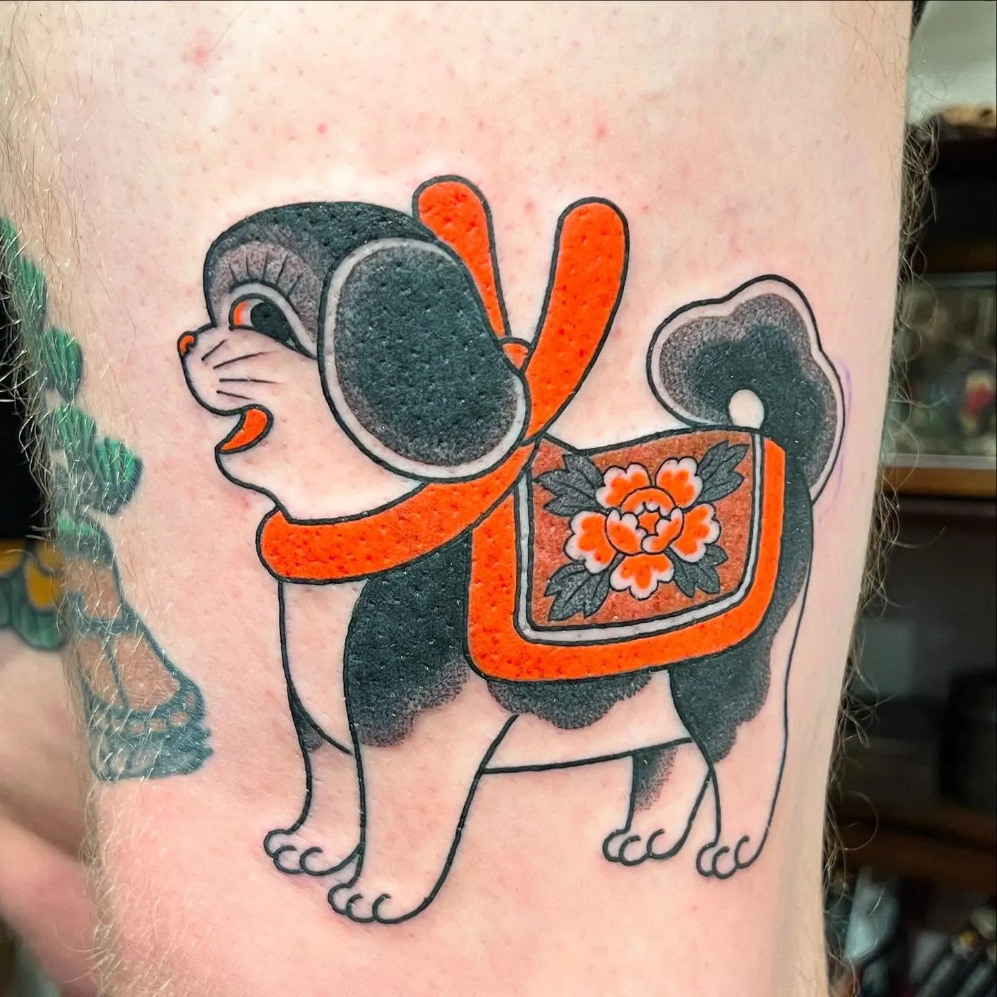 Japanese cute orange dog tattoo