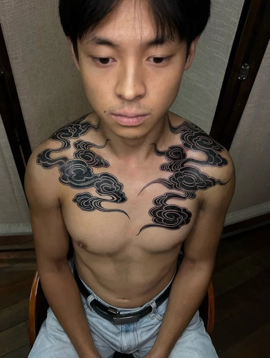 blackwork japanese cloud tattoo on man shoulders