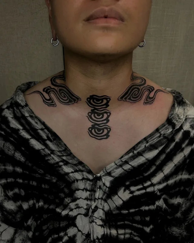blackwork japanese cloud and eyes tattoo around neck