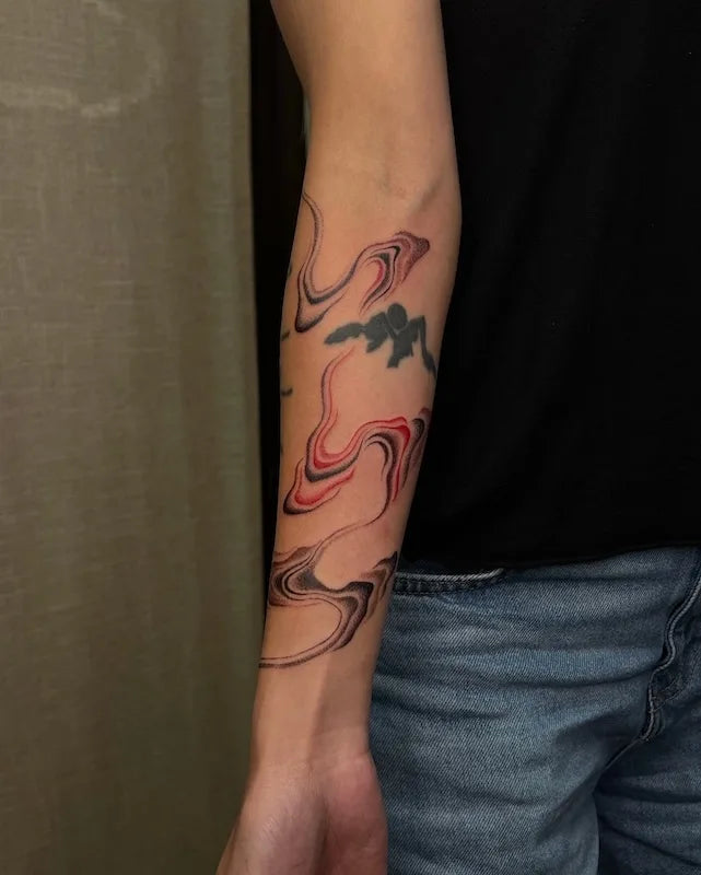 abstract color lines tattoo on forearm