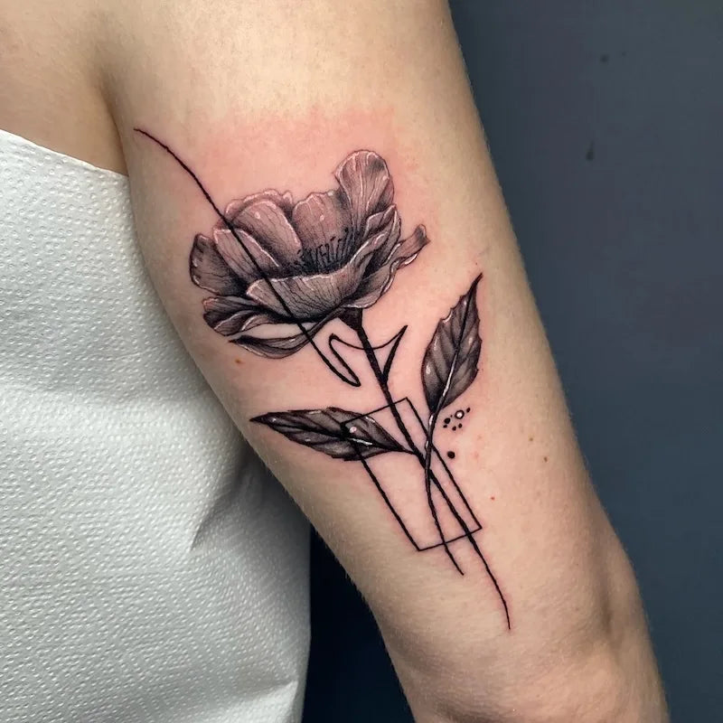 black and grey poppy flower tattoo