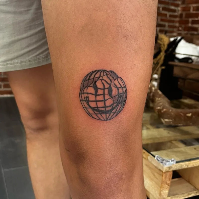 smiley globe tattoo