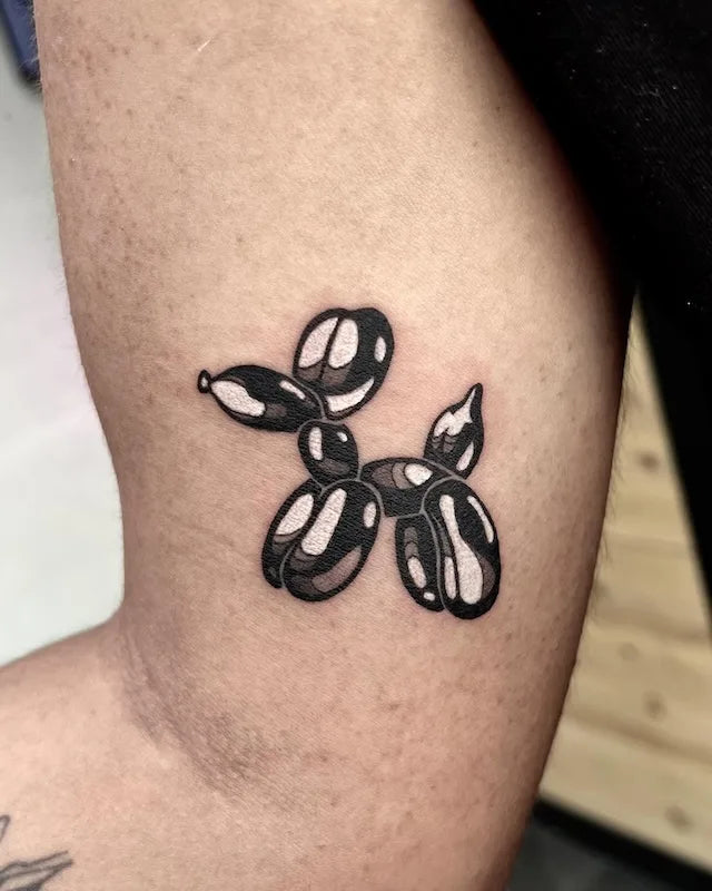 realistic black balloon dog tattoo