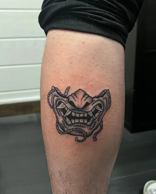 Black and Grey Half Japanese Hannya Mask Tattoo