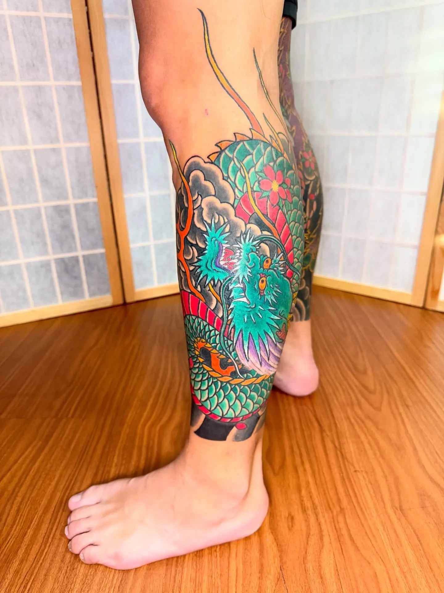 japanese green dragon leg half sleeve tattoo