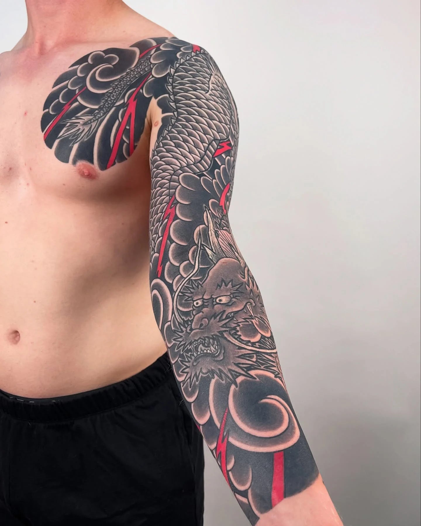 blackwork japanese irezumi dragon full arm sleeve man tattoo
