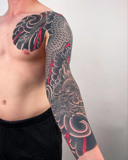 blackwork japanese irezumi dragon full arm sleeve man tattoo