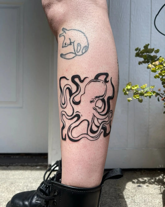 blackwork octopus outline leg tattoo