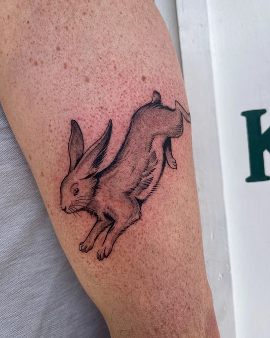black and grey rabbit tattoo