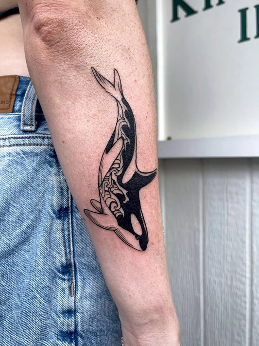 blackwork dolphin forearm tattoo