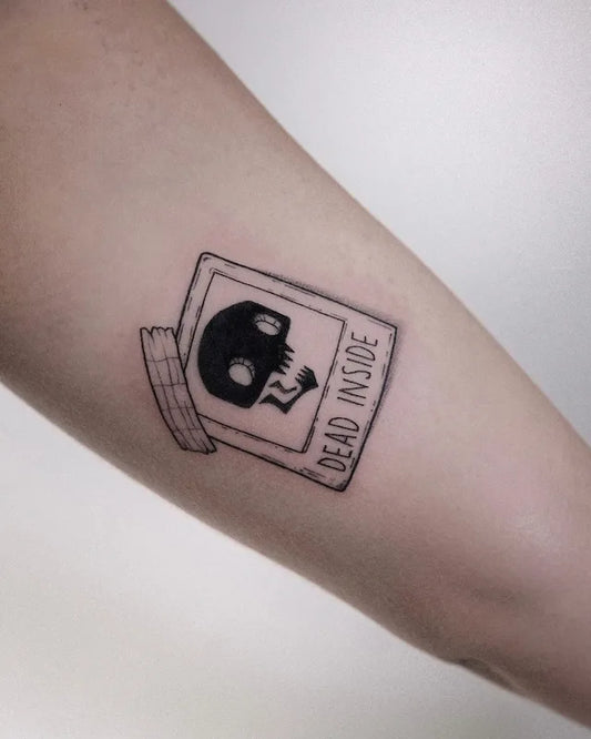 dead inside skull blackwork illustrative tattoo on arm