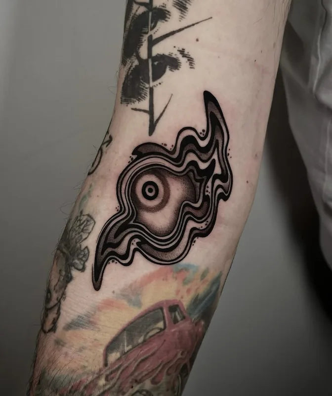 blackwork abstract eye tattoo on arm