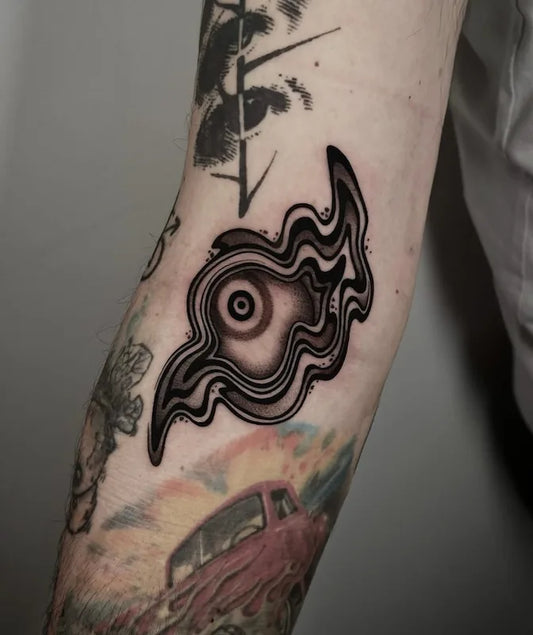 blackwork abstract eye tattoo on arm