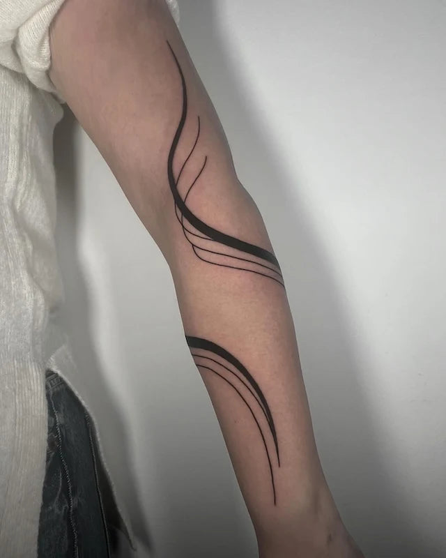 blackwork abstract lines geometric tattoo on woman arm