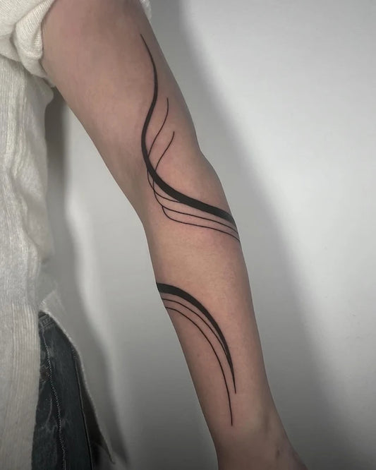 blackwork abstract lines geometric tattoo on woman arm